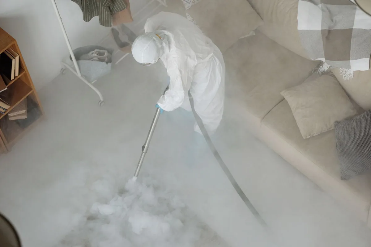 Biohazard cleanup technician in protective equipment, Plum Creek, VA